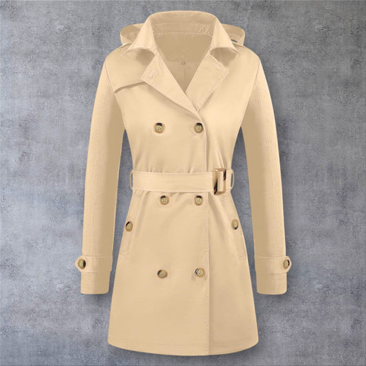 She Is Warm beige hooded trench coat with double-breasted buttons and a belted waist for a classic winter look.