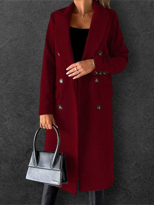 She Is Warm burgundy double breasted long coat with lapel collar and button details worn by a woman